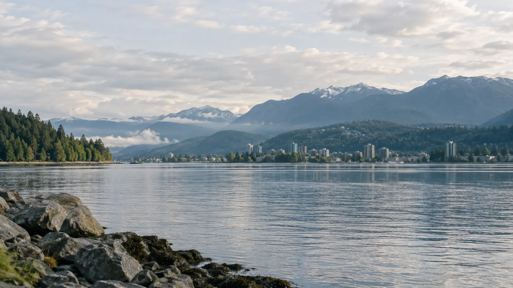 Coastal city, water, and mountains in an illustrative Pacific Northwest setting